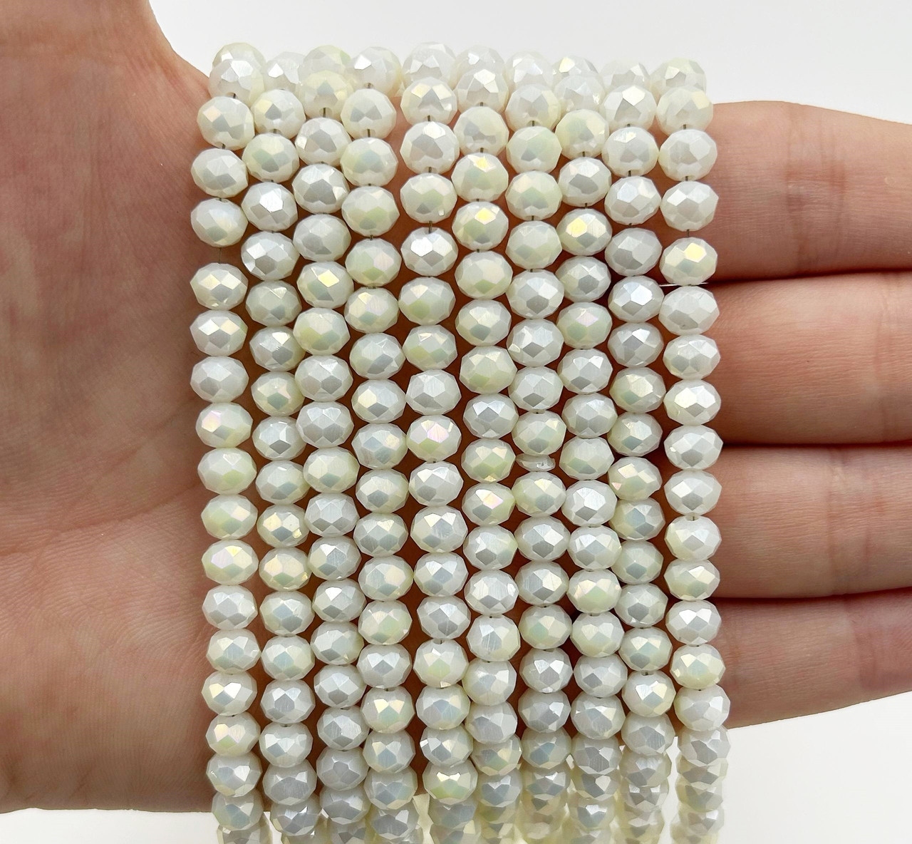 Намистини кришталев (рондель) 6х4мм колір непрозорий бізе